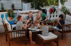 All of the kids, having dinner on the terrace. 