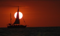 sunset with sailboat closeup